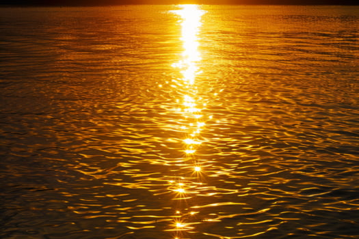 Sunset Sunlight Path on Calm Ocean Waters photo