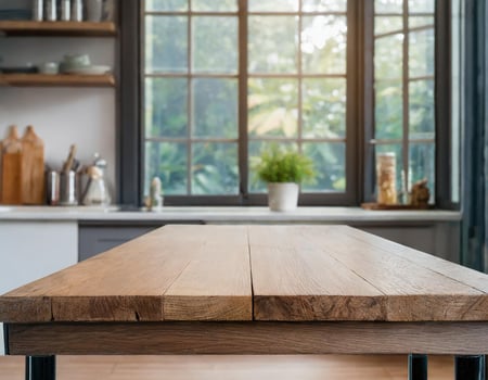 Empty wooden top table in kitchen with blurred window background in the morning photo