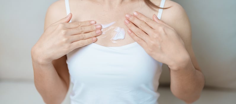Skin care lotion and Skin body cream Moisturizing, Sunscreen and Healthy Daily Routine concepts. Beauty Woman applying moisturizing skincare cream on hand and body at home photo