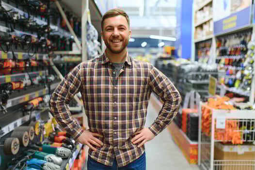Young man working in hardware store photo