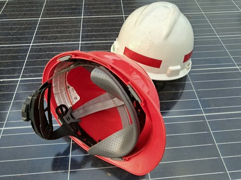 Plastic safety helmet isolated on panel surya background photo