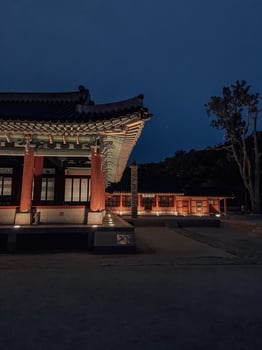 Traditional Korean Architecture Lit Up at Twilight photo