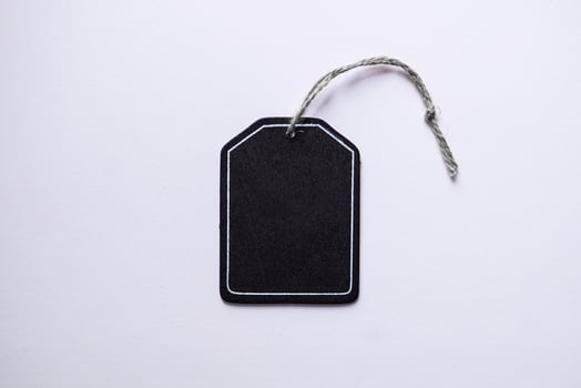 black price tag on the white background, black mockup photo