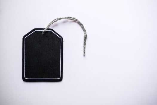 black price tag on the white background, black mockup photo