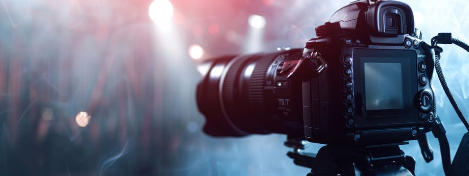 A camera is shown in front of a blurred background photo