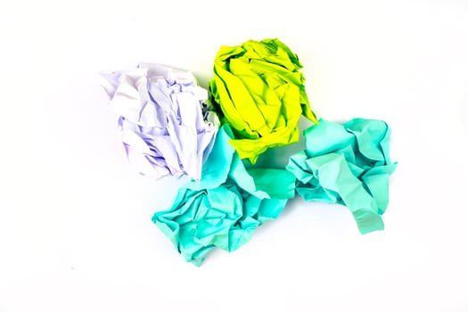 Crumpled and torn color papers, isolated on white photo