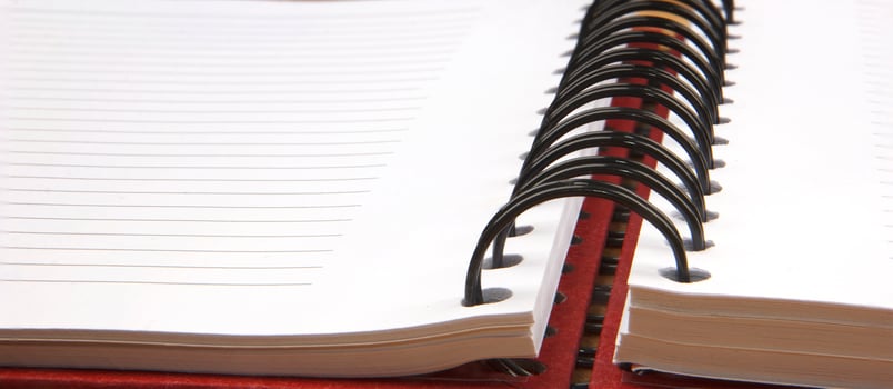Close up of an open spiral notebook. Banner view photo