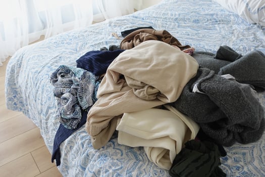 messy bed with cloths in early morning , messy bed after waking up photo