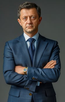 Businessman in Suit and Tie Crossing Arms photo