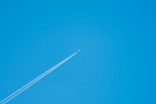 Airplane in sky, centered. photo