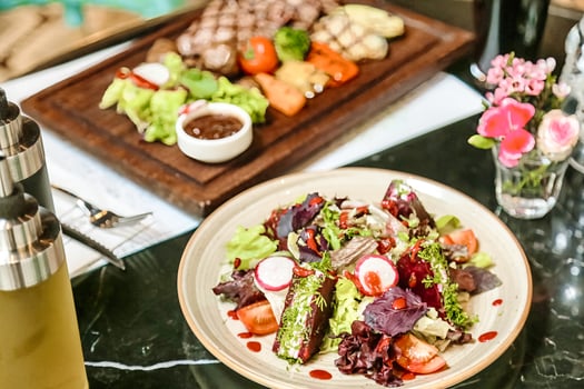 Delicious Plate of Food With Wine Bottle on Table photo