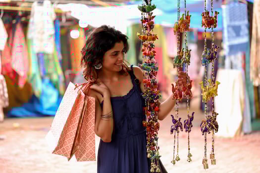 Pretty Female Model Looking At Multicolour Rajasthani Hanging Decoration photo