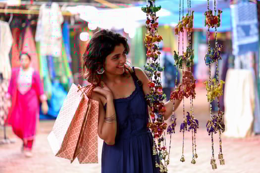 Lady Looking At Multicolour Rajasthani Hanging Decoration photo