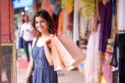 Blonde Female Holding Shopping Bags Outdoor photo
