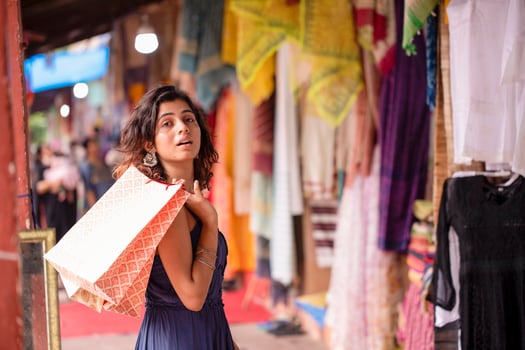 Beautiful Blonde Woman Holding Shopping Bags In Hand photo