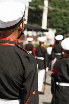 Younger group of a military school in formation to patriot parade of Honduras wearing military clothing and hats. photo