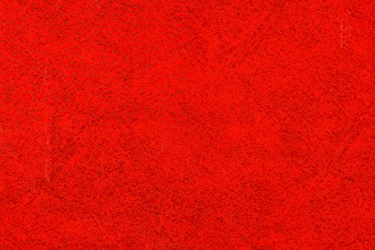 Abstract red background. Texture of the book cover with specks photo