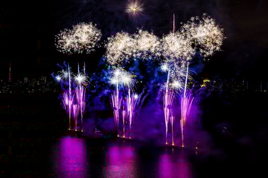 Colored fireworks display on dark sky background. photo