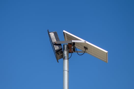 solar-powered street lighting floodlight against the sky 1 photo