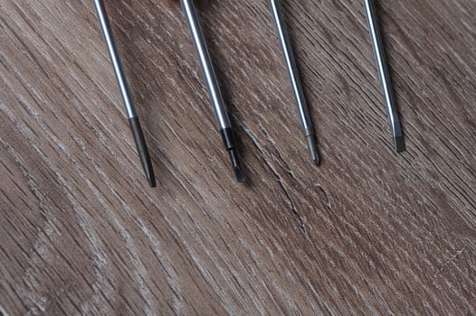 screwdrivers on a wooden table 8 photo