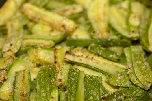 baked zucchini cut into sticks with sesame seeds cooked in the oven 2 photo