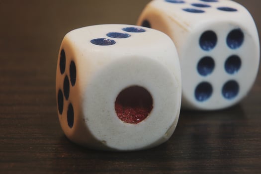 Close up of two dice on a wooden table photo