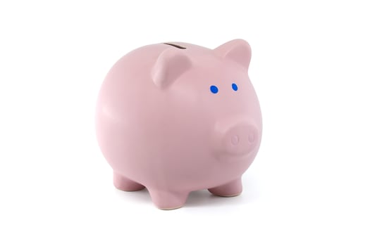 Pink piggy bank isolated on white background photo