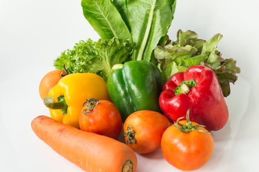 a bunch of vegetables on a white surface photo