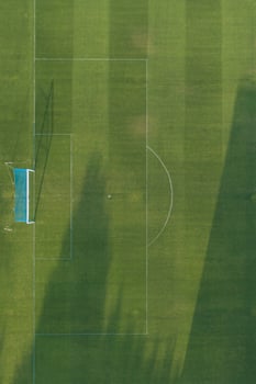 Aerial view of a grass soccer field goal photo