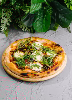 Fresh vegetarian pizza on gray background photo
