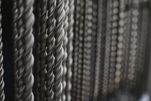 Drills for drilling concrete in a shop window of a hardware store. Close-up. Selective focus photo