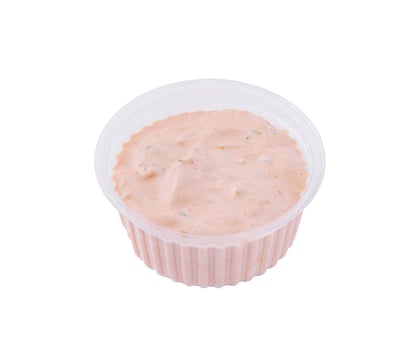 Fresh seafood sauce in plastic container photo