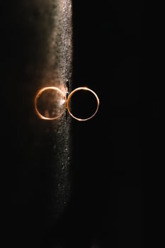 Beautiful wedding rings on light background. photo