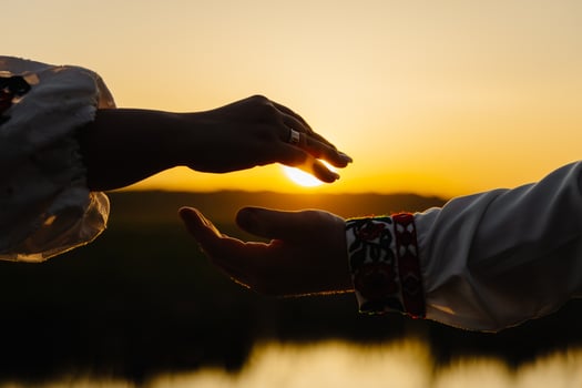 Intimate moment between two people holding hands photo