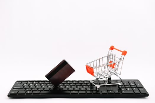 online shopping or internet shop concepts, with shopping cart symbol. isolated. photo