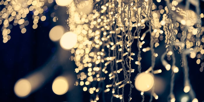 Pale yellow lights bokeh from christmas holiday garlands, blurred festive abstract background lights photo