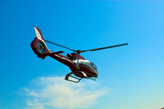 Helicopter flying over the river photo