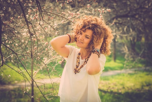 Fashion shot of a beautiful boho style girl on nature background. Boho, hippie. photo