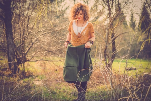 Fashion shot of a beautiful boho style girl on nature background. Boho, hippie. photo