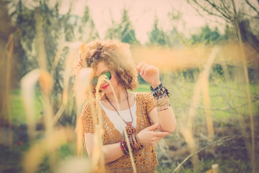Fashion shot of a beautiful boho style girl on nature background. Boho, hippie. photo