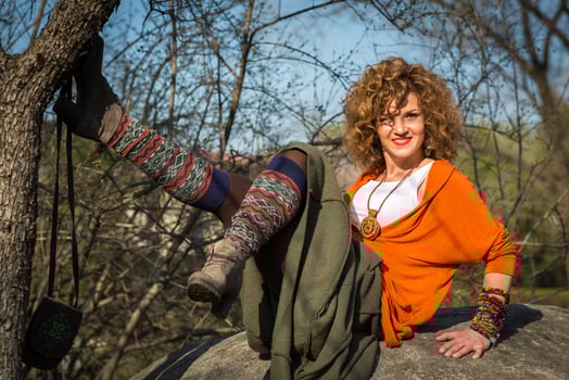 Fashion shot of a beautiful boho style girl on nature background. Boho, hippie photo