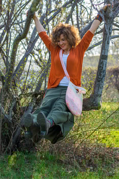 Fashion shot of a beautiful boho style girl on nature background. Boho, hippie. photo