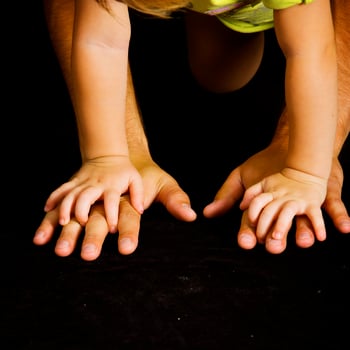Daughter holds the hand of the father photo