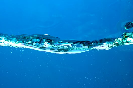 Fresh water with waves and bubbles photo
