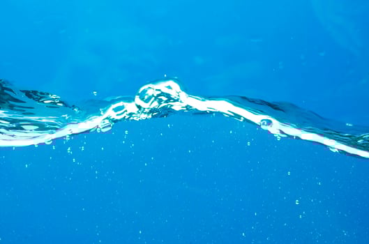 Fresh water with waves and bubbles photo