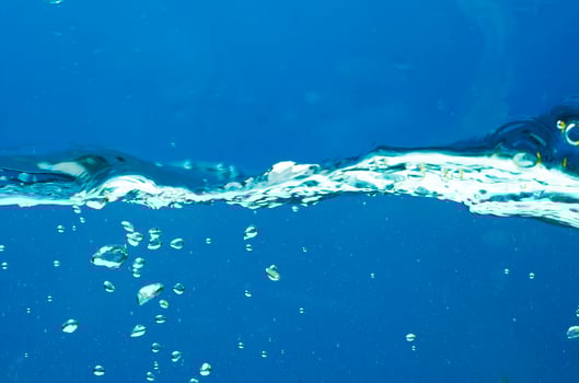 Fresh water with waves and bubbles photo