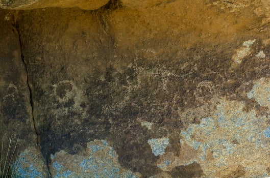 Ancient figures on the the stone photo