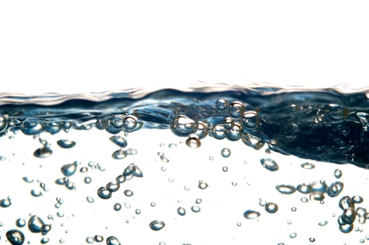 Fresh water with waves and bubbles photo