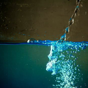 Fresh water with waves and bubbles photo