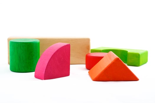 Wooden toy blocks on white background photo